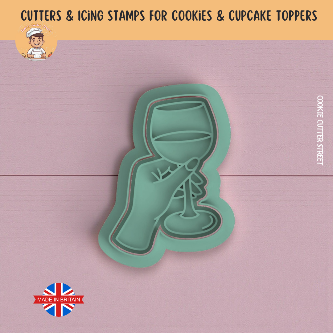 Cookie cutter with wine glass design on a pink background, made in Britain.