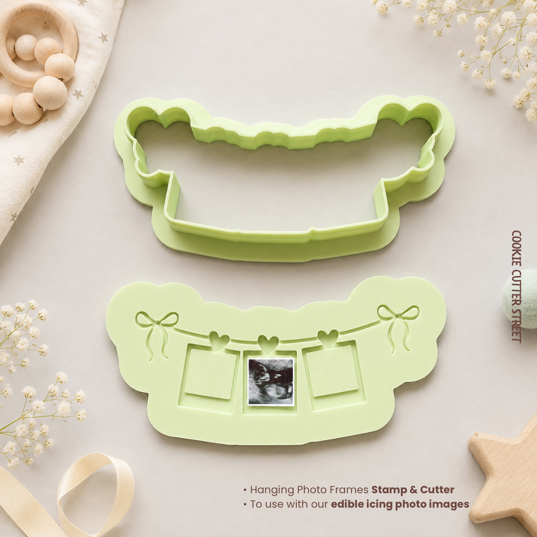 Green cookie cutter with hanging photo frames design on a light background