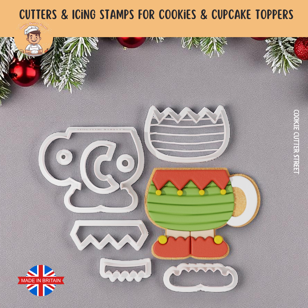 Elf Cup  cookie cutters and icing stamps for cookies and cupcake toppers on a gray background with Christmas decorations.