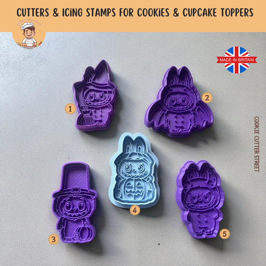 Set of Halloween Cute Furry Monster purple and blue cookie cutters with icing stamps on a grey background, featuring the brand 'Cookie Cutter Street'.