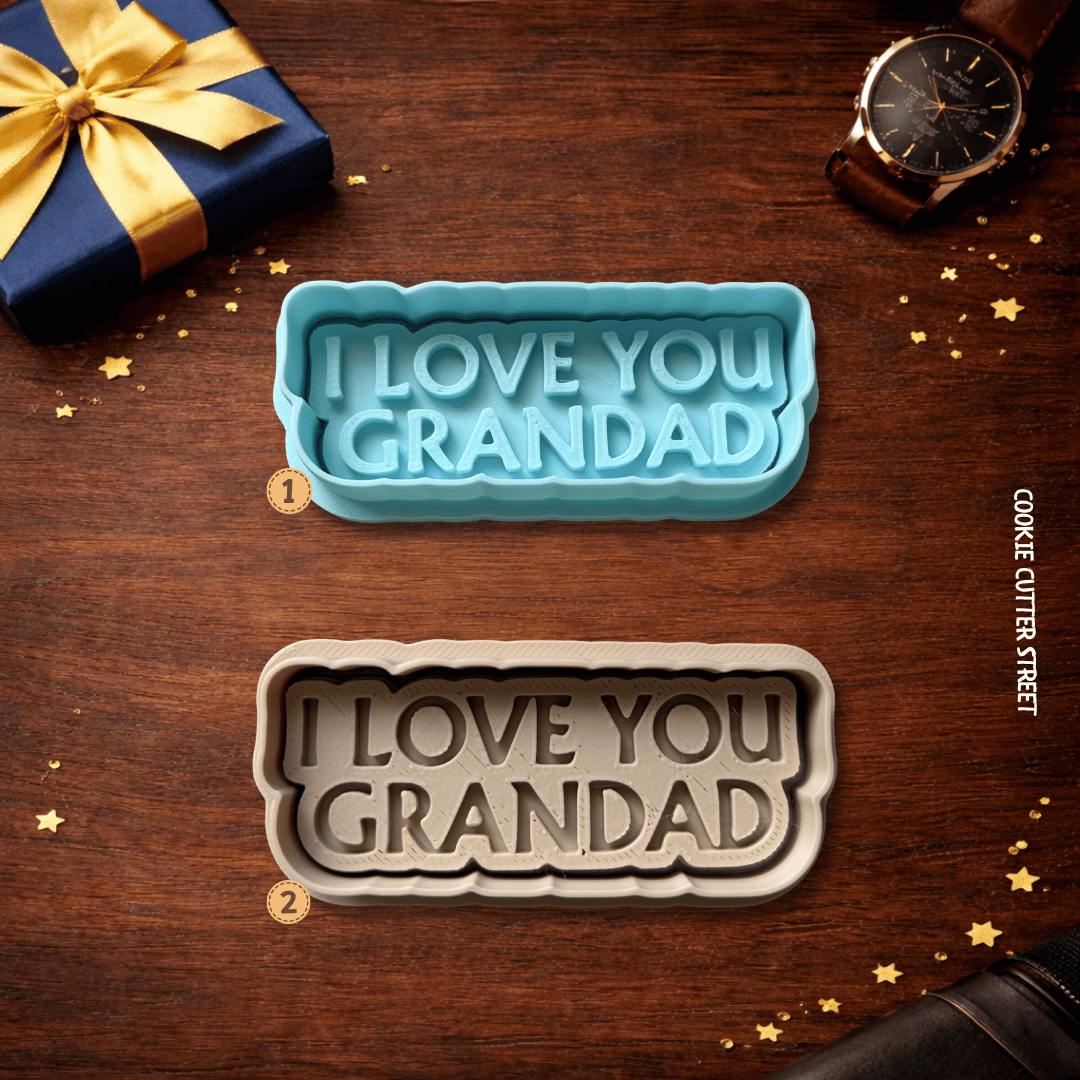 Two cookie cutters with 'I LOVE YOU GRANDAD' text on a wooden surface with decorative elements.