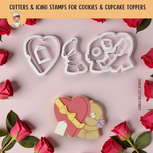 Cookie cutters with 'LOVE' design surrounded by red roses on a pink background