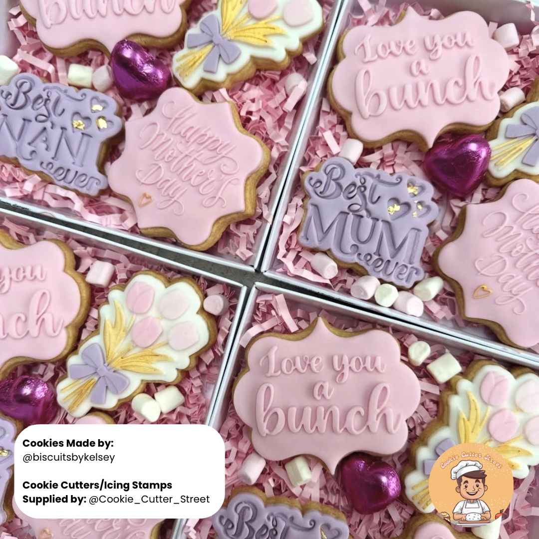 Decorative cookies with text and cookie cutters in a box