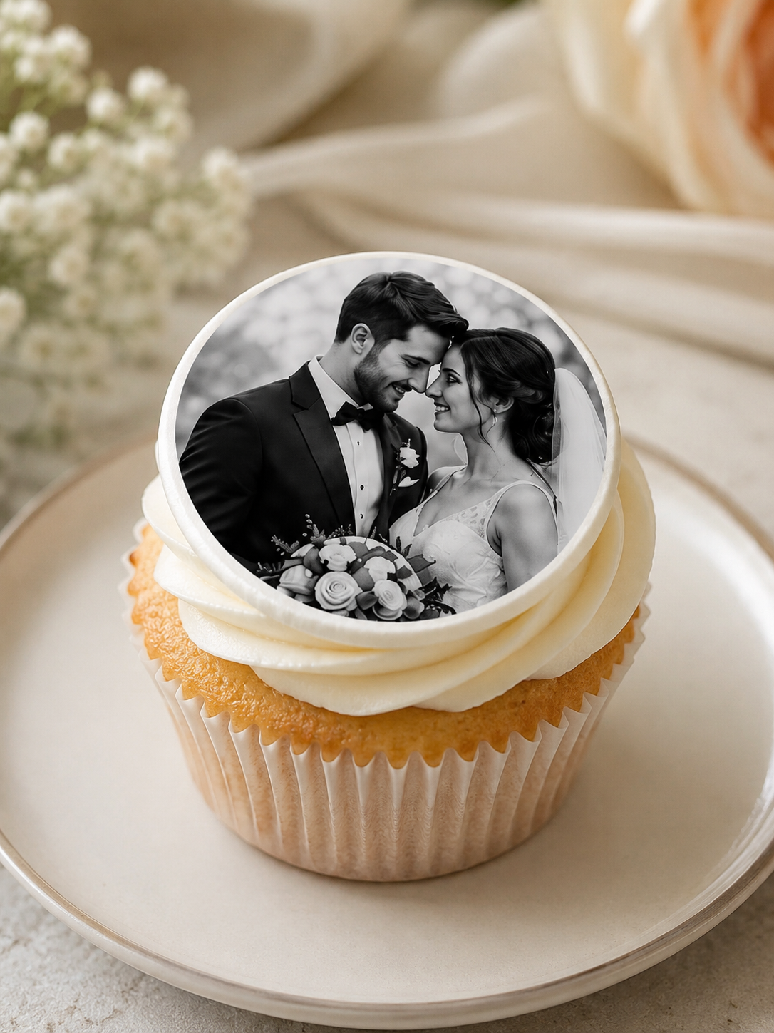 Cupcake with an edible icing photo of a couple on top, set against a soft floral background.