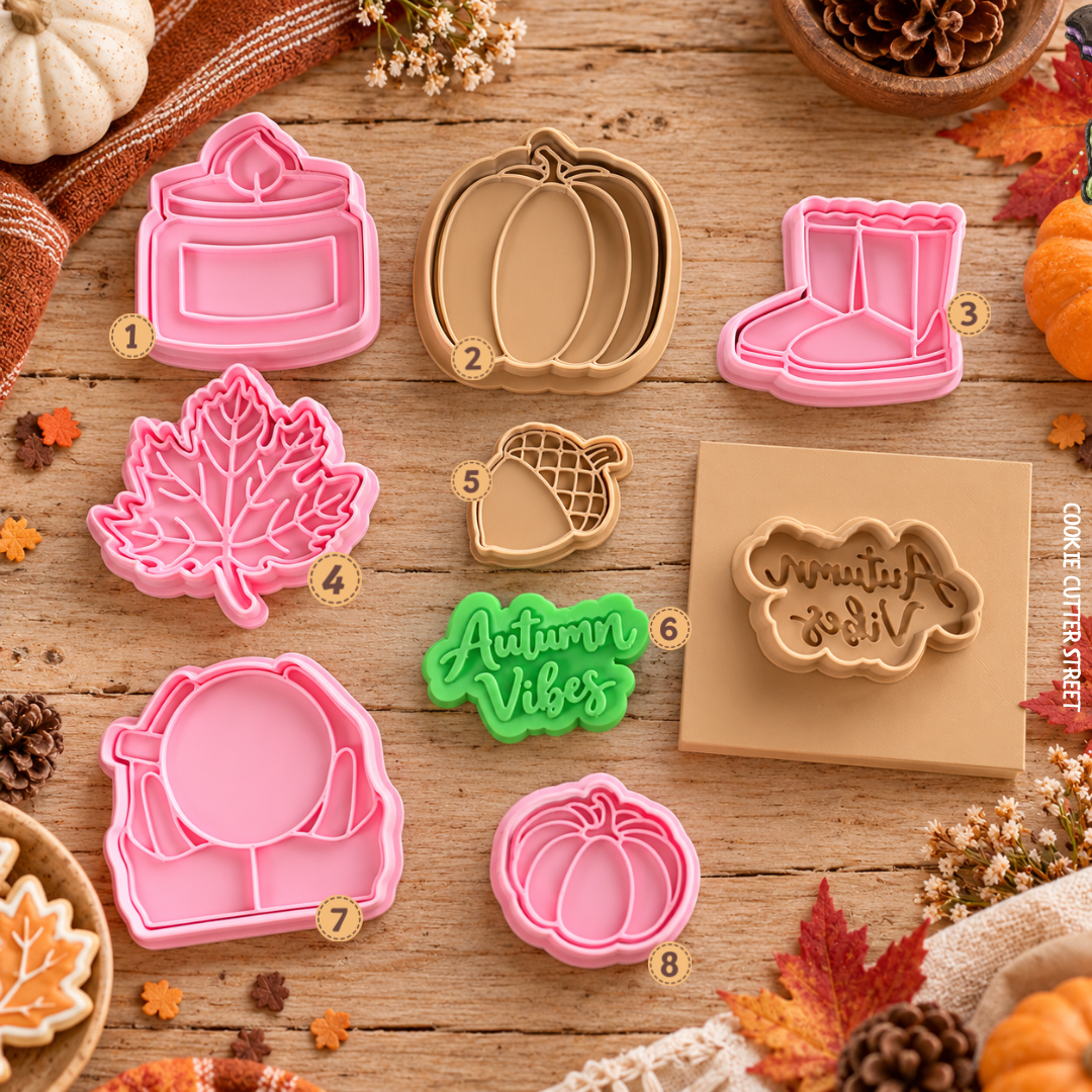 Autumn and fall icing stamps featuring pumpkin, candle, Wellington boots, maple leaf, acorn, Autumn Vibes lettering, cosy mug and mini pumpkin by Cookie Cutter Street.