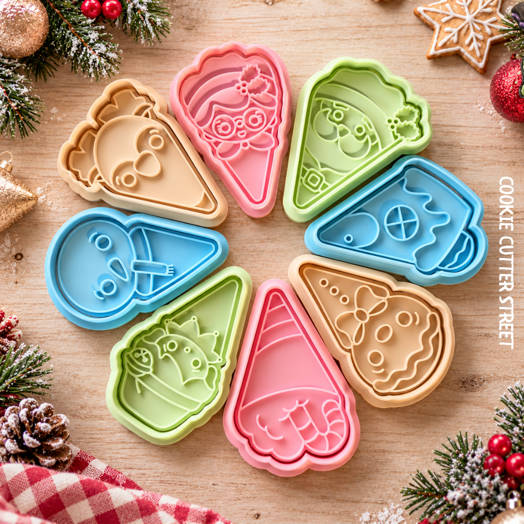 Six colorful cookie cutter shapes arranged in a circle on a wooden surface with holiday decorations around the edges. The cutters include different festive designs such as a gingerbread man, a Christmas tree, a snowman, and holiday treats.