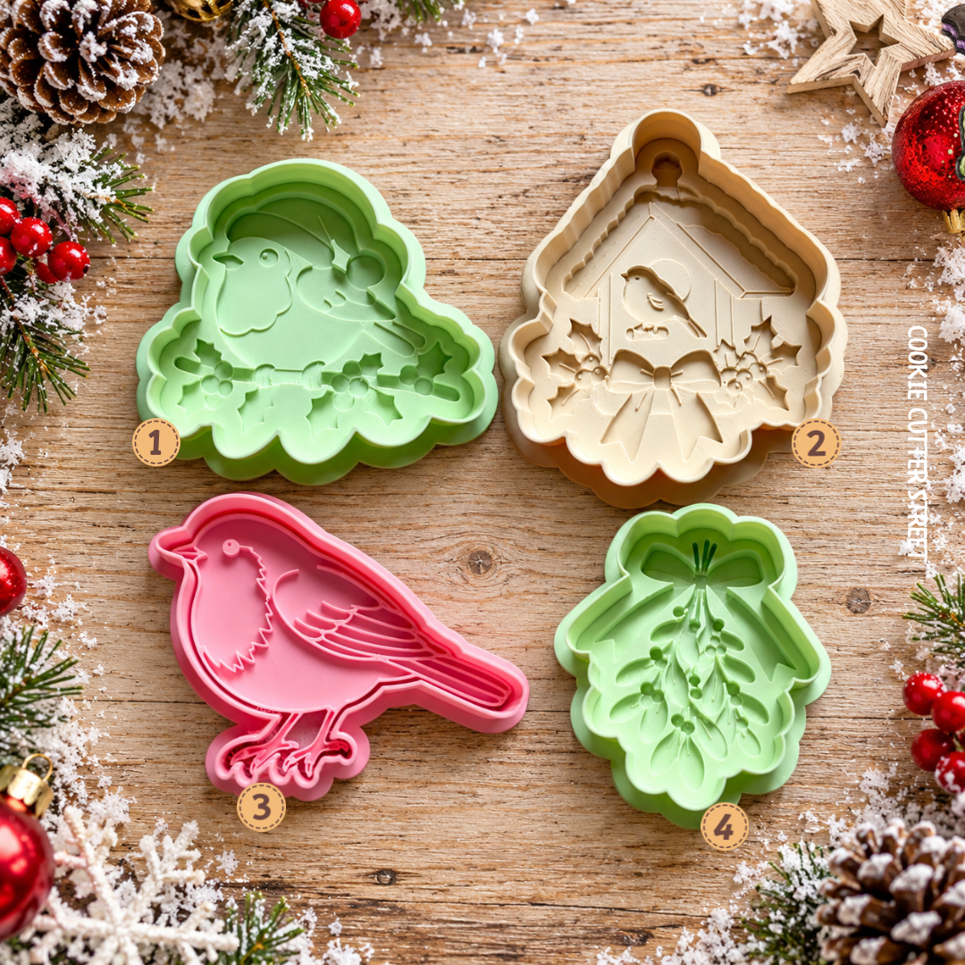 Christmas robin and mistletoe icing stamps and cookie cutters featuring four festive designs for Christmas biscuit decorating.