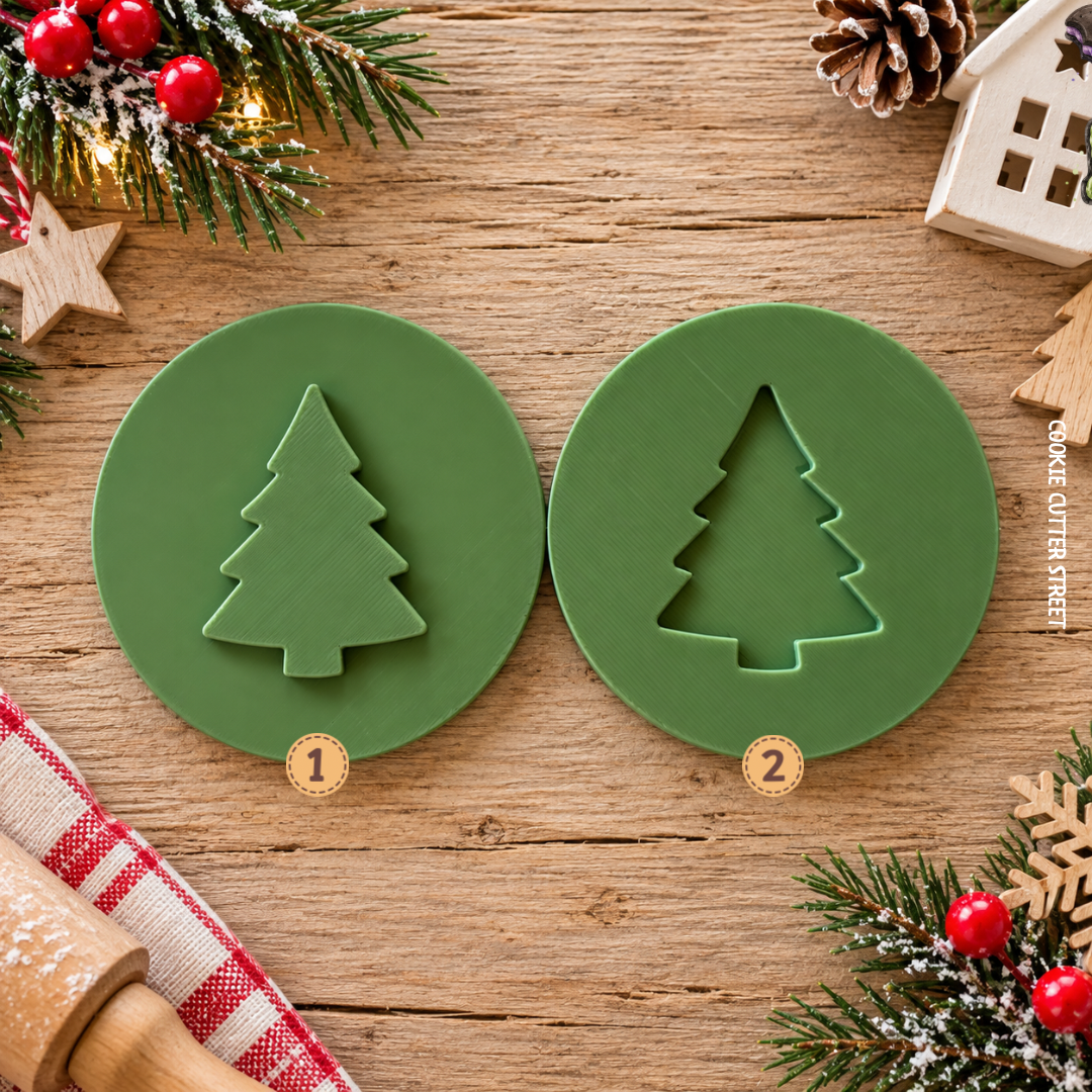 Two round green cookie cutters shaped for Christmas trees, labeled 1 and 2, displayed on a rustic wooden table with holiday decorations.