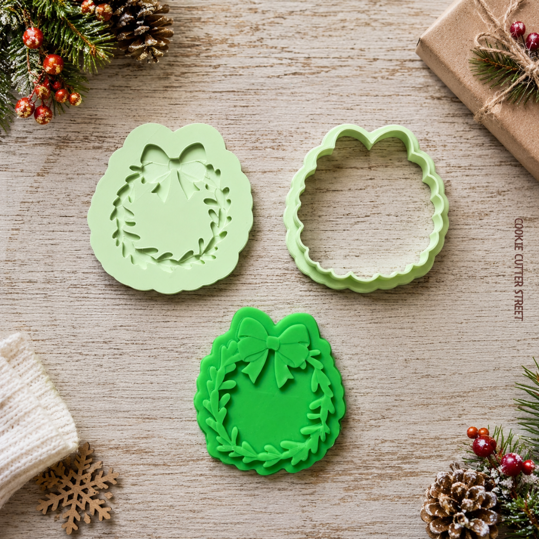 Christmas wreath and bow raised pop-out icing stamp with matching cookie cutter for festive fondant Christmas cookies.