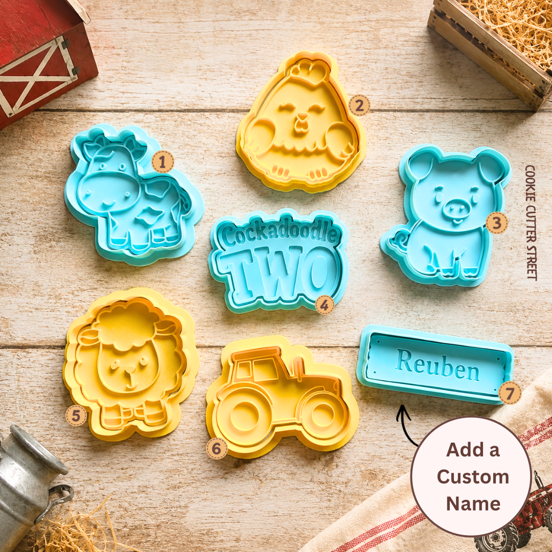 Farm-themed cookie cutter and icing stamp collection featuring cow, pig, sheep, chick, tractor, personalised farm sign and Cockadoodle Two birthday message.