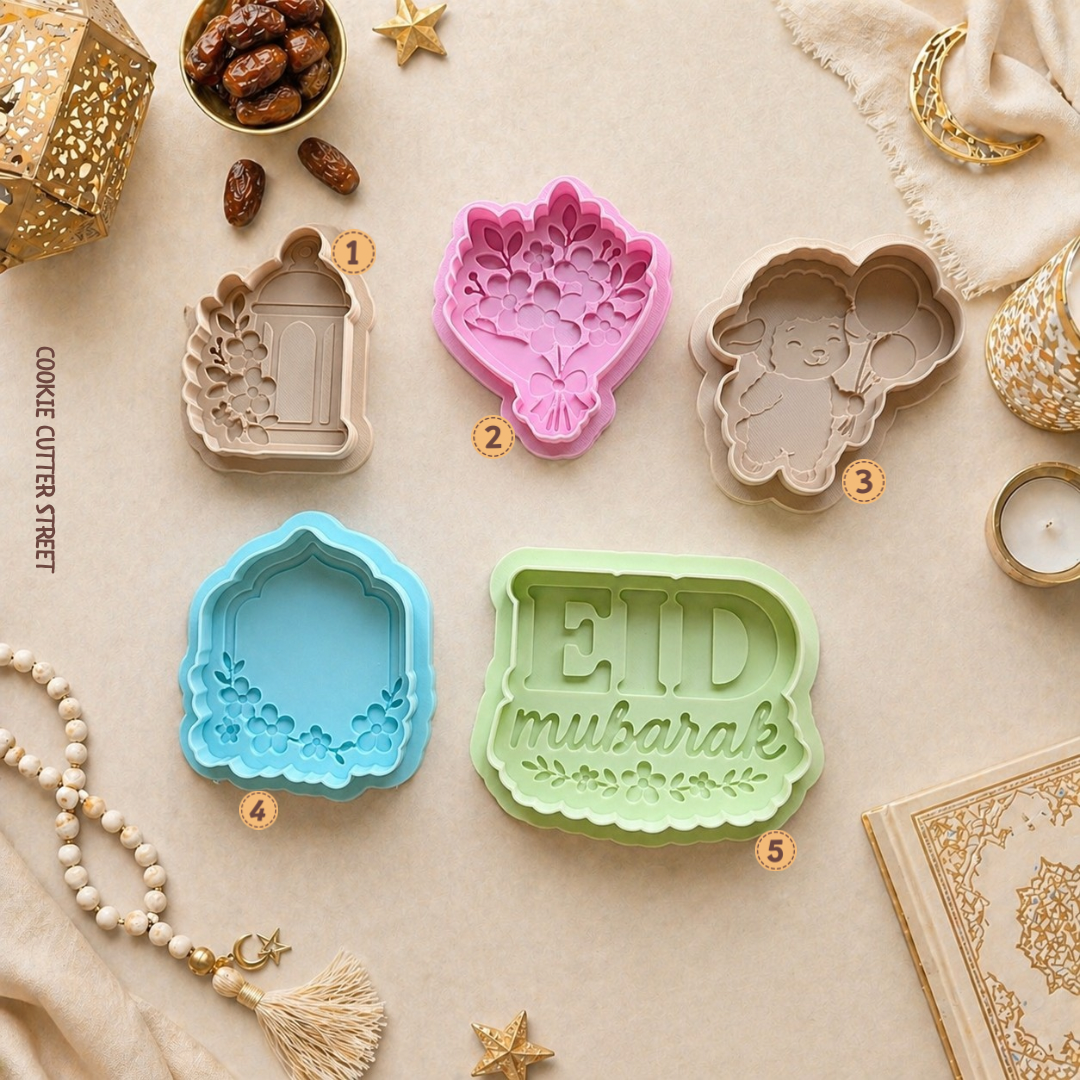 Set of colorful cookie cutters with 'EID mubarak' design on a decorative background.