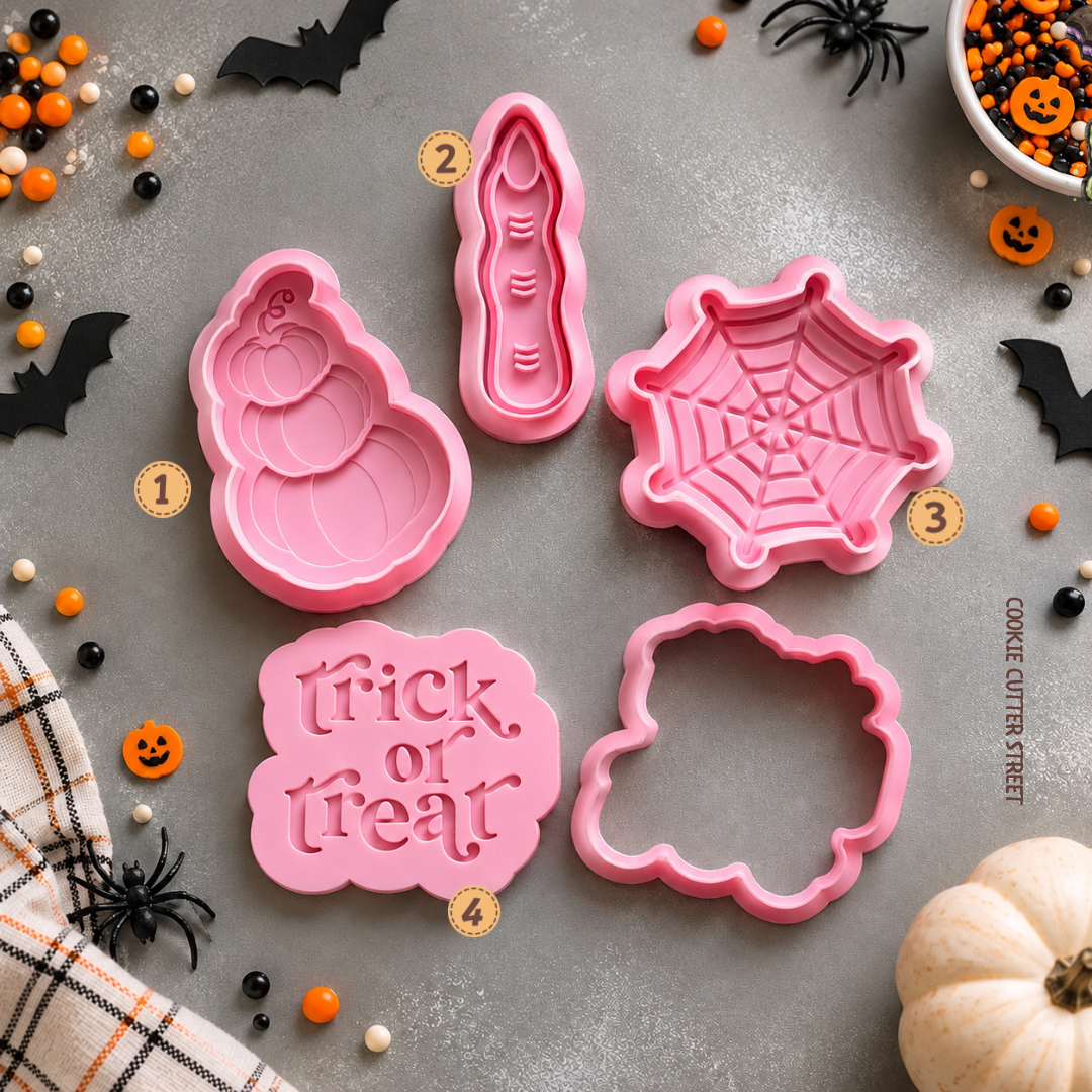 Halloween multi-level and imprint icing stamps featuring stacked pumpkins, witch finger, spider web and Trick or Treat cookie designs