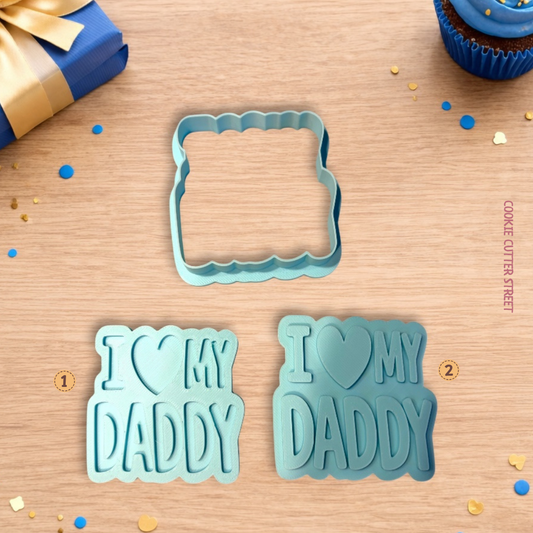 Blue “I Love My Dad” cookie stamp and cutter set shown with raised and imprint design options on a styled background.
