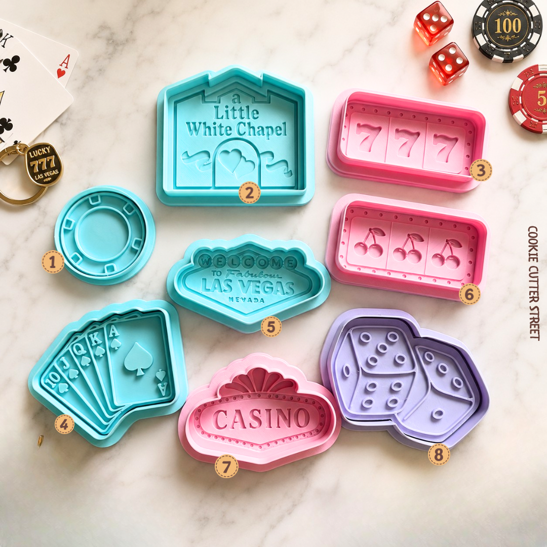 Las Vegas cookie cutter collection featuring casino chips, poker cards, dice, slot machines and iconic Vegas signs for casino-themed celebrations.