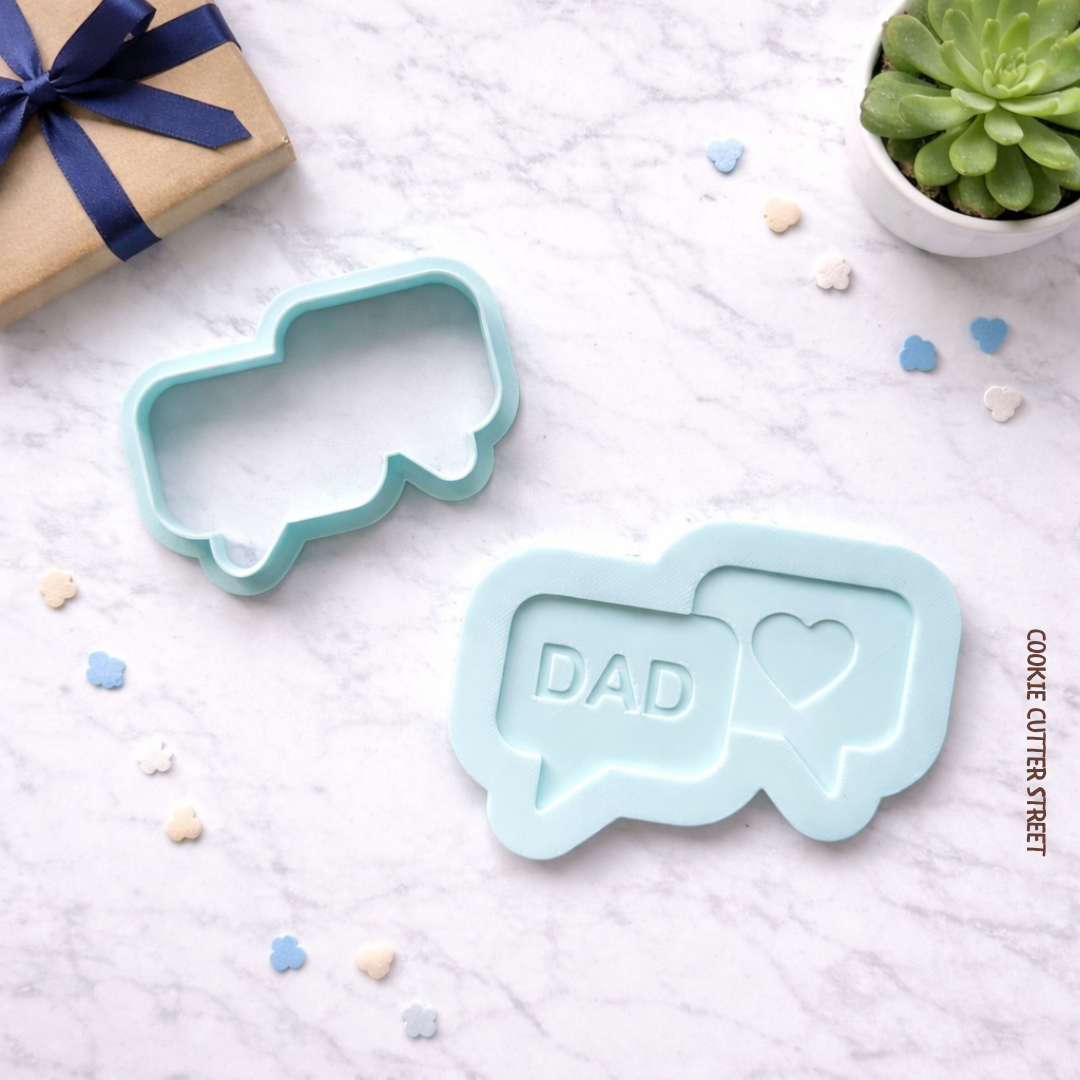 Light blue speech bubble cookie cutter and multi-level stamp featuring “Dad” and heart design for Father’s Day cookies.
