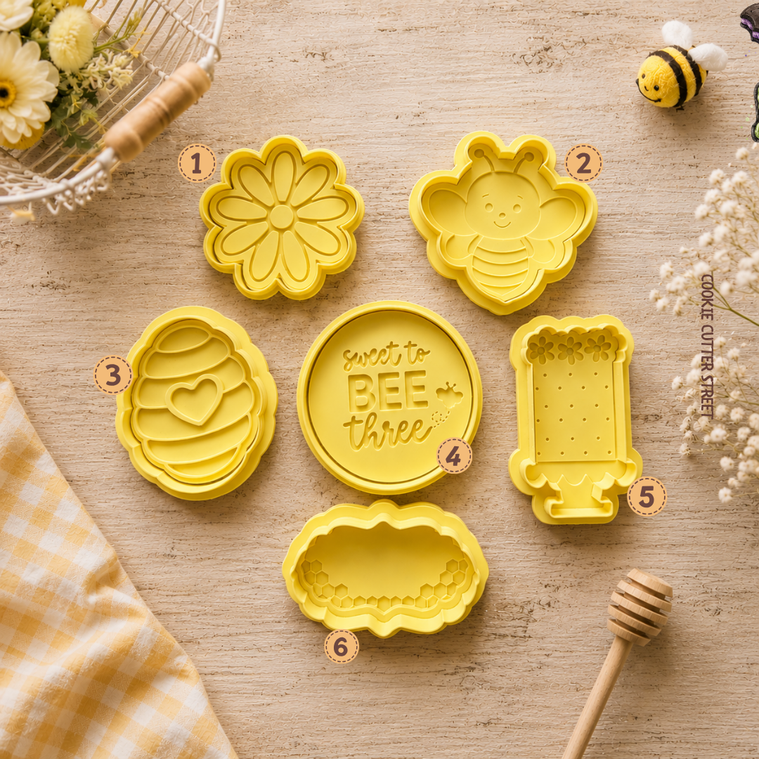 Sweet to Bee Three 3rd birthday cookie cutters and icing stamps featuring bumblebee, daisy, beehive, birthday cake and honeycomb design