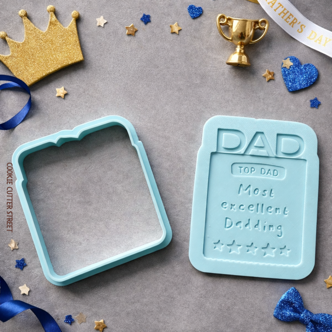Light blue cookie cutter and multi-level stamp featuring “Top Dad – Most Excellent Dadding” award design for Father’s Day cookies.