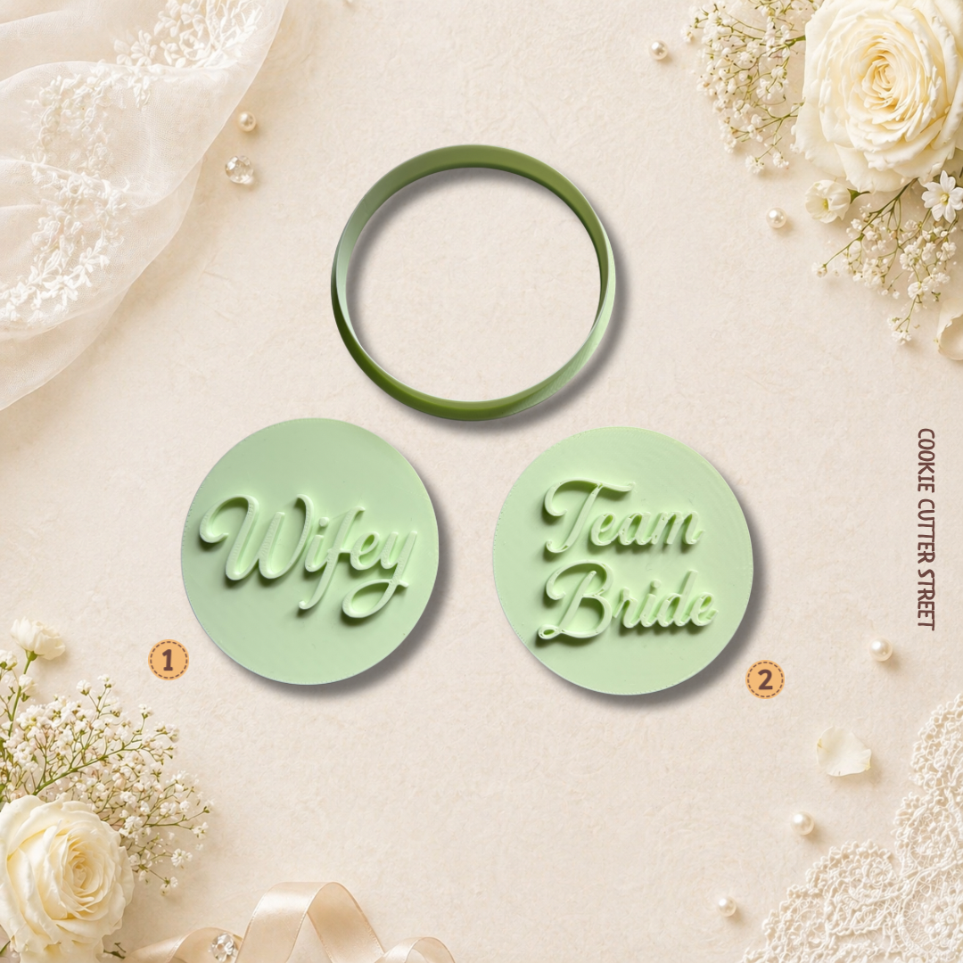 Two green cookie cutters with 'Wifey' and 'Team Bride' text on a decorative background with flowers and ribbons.